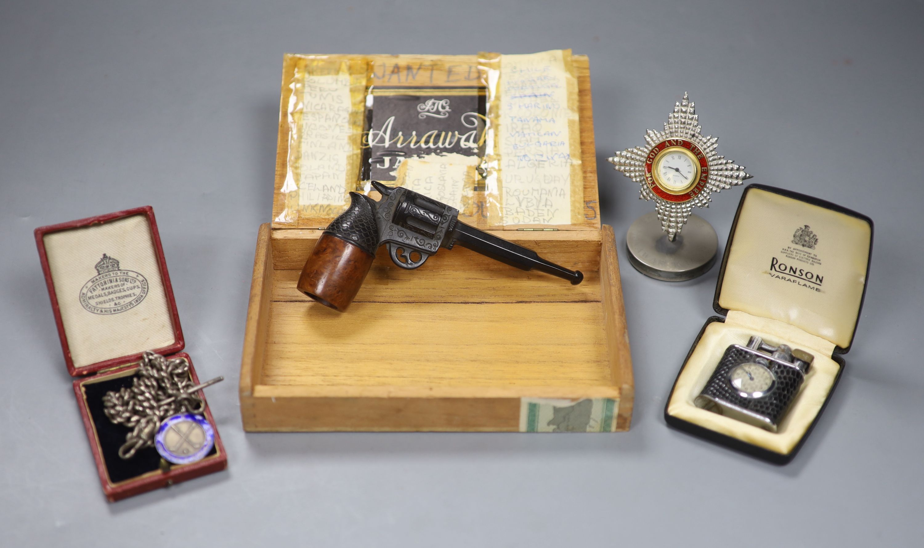 A novely pipe shaped as a pistol, a silver sporting medal and chain and a lighter, etc.